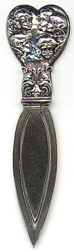 This bookmark is American made in 1913 by Webster Company. It is an art nouveau piece marked only Sterling on the back.The top is a heart shape with pictures of cherub within it. It was sold as a letter opener in the 1913 catalog for 75 cents. 