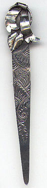 This bookmark is American made sometime between 1900 - 1920. It is an art nouveau piece marked only Sterling on the back.This bookmark has a spring tension clip as it's method of attaching to a page. It is similar to bookmark number 113 from my collection. Manufacturer is unknown.