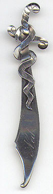 This bookmark is American made by EHH Smith Silver Co. It is marked Sterling, the makers mark and the number 0423. It depicts a snake wrapped around a sword. Date is 1904 - 1920.