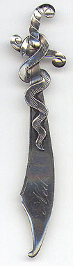 This bookmark is American made by EHH Smith Silver Co. It is marked Sterling, the makers mark and the number 0423. It depicts a snake wrapped around a sword. Date is 1904 - 1920.