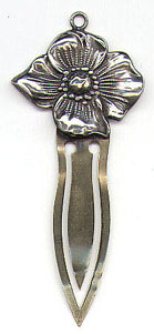 This bookmark is American made by an unknown manufacturer. It is just marked Sterling on the top part. I don't believe that the blade is silver. It is an art nouveau flower made between 1900 and 1920.