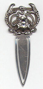 This bookmark is a William B. Kerr & Co. piece. It has the American Beauty mark and is stamped 1320. It is a high relief crab. It was made around 1900.