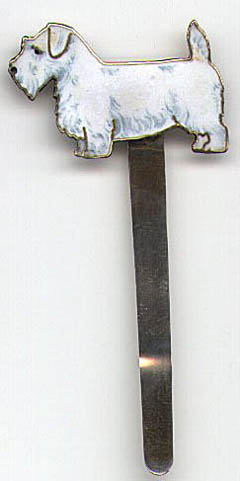 This bookmark is American made by an unknown manufacturer. It is only marked Sterling and is finished in a gold wash. The top of the bookmark is a picture of a West Highland Terrier in enamel. Date is 1900 - 1920.