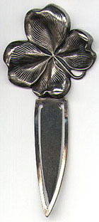 This bookmark is a William B. Kerr & Co. piece. It has the American Beauty hallmark, sterling and is stamped 1989. It is a high relief four leaf clover and was made around 1900.