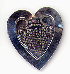 This bookmark is made in the US by an unknown manufacturer. It is stamped (on the front) with the word sterling. Also on the front is the Lord's prayer in relief letters on the inner blade. It is very thin and was probably made 1960 - 1970.