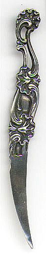 This letter opener is American made by Whiting Manufacturing Co. It is marked Sterling with the manufacturers hallmark and the number 4308. The date is 1896. I originally thought that it was a bookmark but I found it in the 1896 Whiting catalog as a letter opener. 