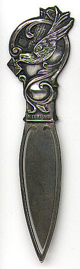 This bookmark is American made by W.H. Saart Co. between 1900 and 1920. It is marked Sterling Front with the makers hallmark. It is a homing pigeon carrying a letter. The blade is not silver.