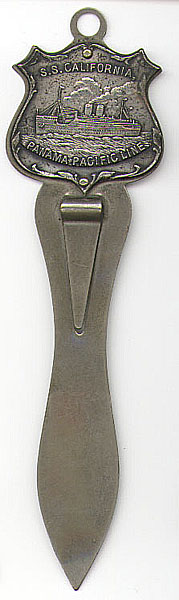 This bookmark was made in the US. It is silver plate and was probably a souvenir bookmark from the S.S. California. It has a picture of the ship on top and reads Panama Pacific Line on the bottom of the shield. The back has a large wreath and bow inscribed. The maker and date are unknown.