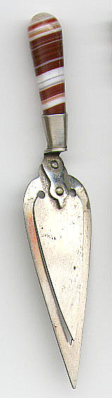 This bookmark was made in either England or Scotland. It is unmarked and is probably not silver. It has an agate handle and is shaped like a trowel. Date is unknown.