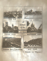 This bookmark is made in France and is a Stanhope or "peeper" bookmark. It is probably silver plate over brass on the fleur de lis on top and brass blades. It was made between 1890 and 1920. If you look through the "peep hole" you can see 6 photographs of different scenes. The center says "In Memory of Isle of Wight". The six photos are: "Ryde Pier", "The Green", "Osborne House", "Whippinghan Church", "SandDown Bay & Esplanade" and "West Cowes". It also says Made in France.