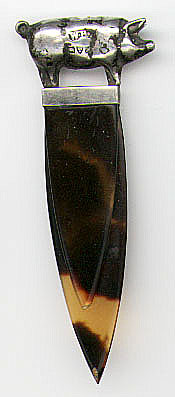 This bookmark was made in Chester England in 1913 by the date mark. The makers mark is W.H. and possibly another letter which is too warn to see. It is a silver pig on top with tortoise shell blades.