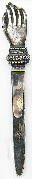 This bookmark was made in the US. It is silver plated over brass and was made sometime in the 1890's - 1910. It is a hand with a fancy cuff. It is unmarked.