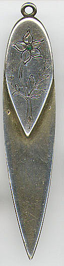 This bookmark was made in France. It is silver with the remnants of a gold wash which it had at one time. It has two French marks, the wild boars head and the lozenge with the makers mark inside. The boars head mark was discontinued in 1961 so the date of this is sometime before then.