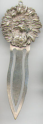 This bookmark was made in the US. It is unmarked with a sterling silver top and silver plate over brass blades. It is an art nouveau piece dated between 1900 - 1920. The maker is unknown.
