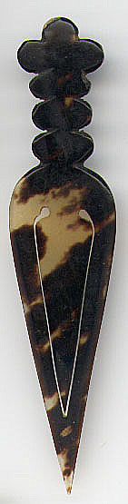 This bookmark was made in England. It is made entirely of tortoise shell probably around 1900 - 1920. It is not marked.