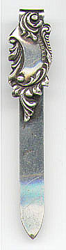 This bookmark was made in the US. It is only marked Sterling and the top blade is in the shape of something art nouveau. It was probably made between 1900 - 1920. The manufacturer is unknown.