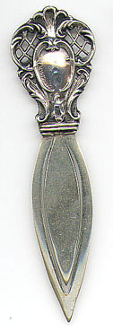 This bookmark was made in the US by Webster Company. It is only marked Sterling and the top and is in the shape of something art nouveau. It was made in 1913 and was sold as a letter opener and as part of a novelty set. 