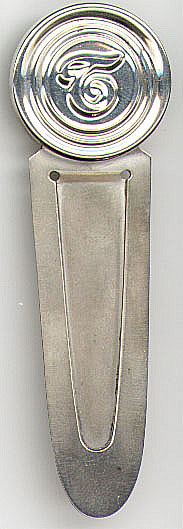 This bookmark is made in the US. It is marked Sterling "by Duchin" on the back. The top is a circle around the letter T. The date is unknown.