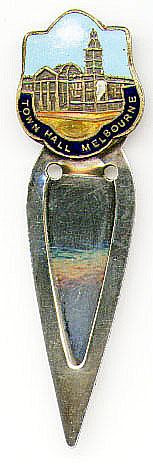 This bookmark is made in Australia. The top part of the bookmark is an enamel on brass picture of the Town Hall Melbourne. The blades are not silver. It is marked Pitcher Melb. on the back. The date is unknown.