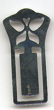 This bookmark is made in the US by James Avery, Craftsman, Inc. It was probably made between 1954 and 1970. The top is a cutout of a butterfly. It is marked with the manufacturers mark and Ster.