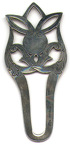 This bookmark is made in the US by Webster Company from North Attleboro, Mass. It is marked Sterling and the manufacturers mark. It is a strange mark in that there is no apparent way that it can be used to clip onto a page like most other bookmarks. It's possible that it is not a bookmark at all but if not, then what is it? The date is between 1910 and 1930.