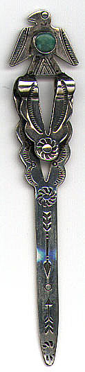 This is a Fred Harvey era Navajo sterling silver and turquoise bookmark circa late 1920's - early 1930's. The top is a thunderbird with a turquoise cabochon stone and the blade has been stamped with an arrow design.