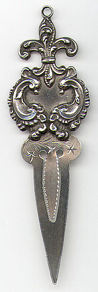 This bookmark is made in the US. It is only marked Sterling. The top has a fleur-de-lis with a ring on top for a tassel. The date is 1900 - 1910.