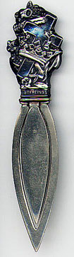 This bookmark was made in the US by Webster Company. It is only marked sterling on the top of the mark. The bottom blades are  silver plate. The top of the mark has a cross behind a crown and flowers. This was originally sold as a letter opener in the Webster catalog. The date is 1913. 