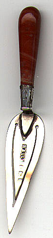 This bookmark was made in Birmingham, England in either 1902 or 1927 from the mark as shown above. It is in the shape of a thin trowel with a reddish agate handle.