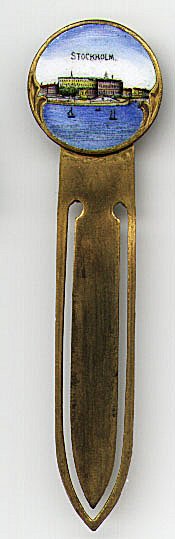 This bookmark is made in Sweden. It is an enamel picture of Stockholm on brass. These are usually found on collector spoons. The date is unknown.