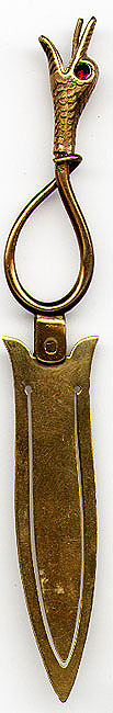 This bookmark was made in England or Scotland circa 1900. The top is in the shape of a serpent with it's mouth open and it's tongue sticking out. The eyes are made of real rubies and the rest is brass.