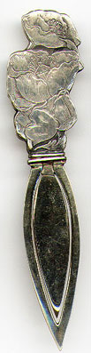 This bookmark is American made but is only marked Sterling. I believe that only the top part is silver. It was made by Webster Company and sold as a letter opener. The top is the state flower of California.  Date 1900 - 1910.