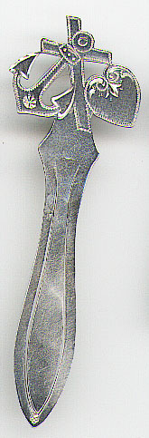 This bookmark was made in Sweden. It is marked only with the Swedish import mark. The top has an anchor, cross and heart symbolizing faith, hope and charity. The date is 1920 - 1930.