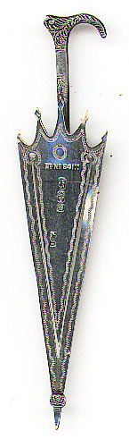 This bookmark was made in Birmingham, England in 1887. It is marked with the makers mark of JW (possibly Joseph Willmore), the standard marks for Birmingham and 1887 and also Rd No 84111. It is in the shape of an umbrella.