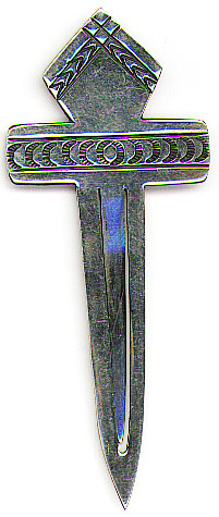 This bookmark was made in the US by an unknown manufacturer. It is marked only Sterling. It is in the shape of a cross with a diamond on top and the front is hand stamped. The date is unknown.