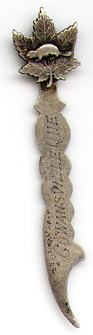 This bookmark was made in Canada. It is marked Sterling and an also has a makers mark. The top is a maple leaf with a beaver inside. The bottom blade is inscribed "Cowansville Que". The date is 1920 - 1930.
