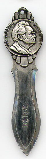 This bookmark was made in Norway. It is unmarked and I believe it is silver plate. The top is the head of man which is surrounded by the words "Bjornstjerne Bjornson". The middle blade is scribed Norge. The date is 1920 - 1930.