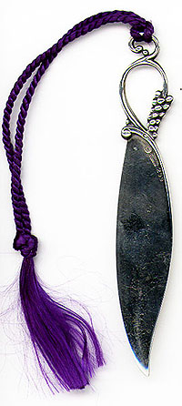 This letter opener was made in Denmark and exported to Sweden by Georg Jensen sometime after 1945. This is currently sold in the Georg Jensen catalog. Originally I thought it was a bookmark because of the tassel but it was put on after the fact and is not sold with one.