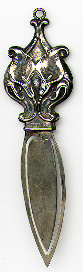 This bookmark was made in the US by an unknown manufacturer. It is marked Sterling and sterling front. The top is two lilies in a victorian style which puts the bookmark between 1900 - 1910.