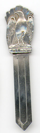 This bookmark was made in  Iceland. It is marked with two letters, both "S", and each surrounded by a cirle. It is also marked 830S. The top is an eagle and has the word "Island" underneath the eagle's claws. The date is unknown.