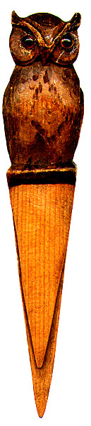 This bookmark was made in the US by an unknown manufacturer. It is made of wood and has a hand carved owl at the top. Date is unknown.