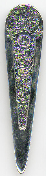 This bookmark was made in the US by Shreve, Crump & Low Co. between 1888 - 1900. It is marked S.C.& L. Co., Sterling and 1. It has art nouveau flowers on the front and middle blade.