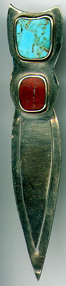 This bookmark is made in Chile and is marked Chile on the back. It is not silver. It has two stones, one turquoise and the other a red stone. The date is unknown.  