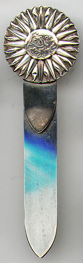 This bookmark was made in the US by Hayden Mfg. Co. between 1893 and 1909. It is marked with the manufacturers hallmark and sterling. The top is a sun symbol with the words "Easter Greeting".
