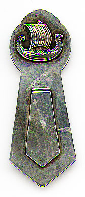 This bookmark was made in Norway between 1920 - 1940. It is marked 830S and the letter H. The top is a picture of a Norse ship.