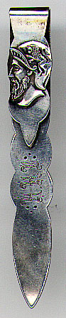 his bookmark was made in the US by the Towle Silversmiths company between 1900 and 1910. It is marked with the manufacturers hallmark the word sterling and the number 15. The top blade is the head of a greek warior with a picture of a lion on his helmet. The bottom blade has the initials "CHH".