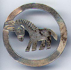 This bookmark was made in Mexico. It is marked Hechoen Mexico, DF 925 GZH and the National symbol of the eagle with the number 90 inside. It is round with the center blade of a donkey.