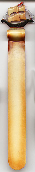 This bookmark was made in the US probably in the 1930's. It is made of celluloid and has a sailing ship on the top.
