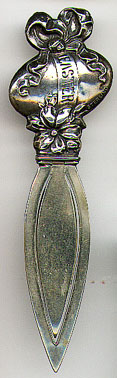 This bookmark was made in the US most likely by Webster Co. the top is marked Sterling and depicts an Easter egg wrapped in a bow on top of a flower. The ribbon on the egg is marked Easter. The date is 1913 and was sold as a letter opener. 