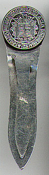 This bookmark was probably made in Norway. It is marked HJ 830S on the back. The top is a round medalion with the names of five continents? "America Europa Asia Oceania Africa" encircling some sort of open book. The date is 1920 - 1930.